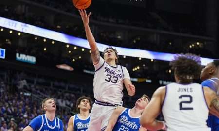 Dec 17, 2024; Kansas City, Missouri, USA; Kansas State Wildcats guard Coleman Hawkins (33) shoots during the first half against the Drake Bulldogs at T-Mobile Center. Mandatory Credit: Jay Biggerstaff-Imagn Images