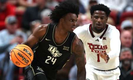 Dec 31, 2024; Lubbock, Texas, USA; Central Florida Knights guard Jaylin Sellers (24) dribbles the ball against Texas Tech Red Raiders guard Kevin Overton (1) in the first half at United Supermarkets Arena. Mandatory Credit: Michael C. Johnson-Imagn Images