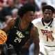 Dec 31, 2024; Lubbock, Texas, USA; Central Florida Knights guard Jaylin Sellers (24) dribbles the ball against Texas Tech Red Raiders guard Kevin Overton (1) in the first half at United Supermarkets Arena. Mandatory Credit: Michael C. Johnson-Imagn Images