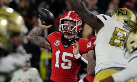 Georgia quarterback Carson Beck (15) throws the ball during the first half of a NCAA college football game against Georgia Tech in Athens, Ga., on Friday, Nov. 29, 2024.