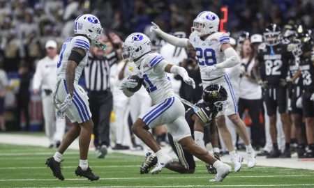 Dec 28, 2024; San Antonio, TX, USA; Brigham Young Cougars cornerback Evan Johnson (21) runs with the ball after an interception during the game against the Colorado Buffaloes at Alamodome. Mandatory Credit: Troy Taormina-Imagn Images