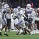 Dec 28, 2024; San Antonio, TX, USA; Brigham Young Cougars cornerback Evan Johnson (21) runs with the ball after an interception during the game against the Colorado Buffaloes at Alamodome. Mandatory Credit: Troy Taormina-Imagn Images