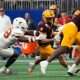 Arizona State running back Cam Skattebo (4) is tackled by Texas linebacker Barryn Sorrell (88) during the first quarter of the Chick-fil-A Peach Bowl in Atlanta on Wednesday, Jan. 1, 2025.