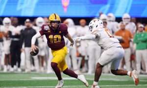 Jan 1, 2025; Atlanta, GA, USA; Arizona State Sun Devils quarterback Sam Leavitt (10) looks to pass the ball against Texas Longhorns linebacker Anthony Hill Jr. (0) during the second half of the Peach Bowl at Mercedes-Benz Stadium. Mandatory Credit: Brett Davis-Imagn Images