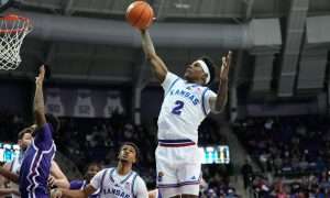 Jan 22, 2025; Fort Worth, Texas, USA; Kansas Jayhawks guard AJ Storr (2) grabs a rebound against the TCU Horned Frogs during the first half at Ed and Rae Schollmaier Arena. Mandatory Credit: Chris Jones-Imagn Images