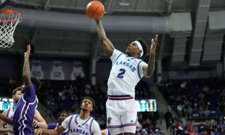 Jan 22, 2025; Fort Worth, Texas, USA; Kansas Jayhawks guard AJ Storr (2) grabs a rebound against the TCU Horned Frogs during the first half at Ed and Rae Schollmaier Arena. Mandatory Credit: Chris Jones-Imagn Images
