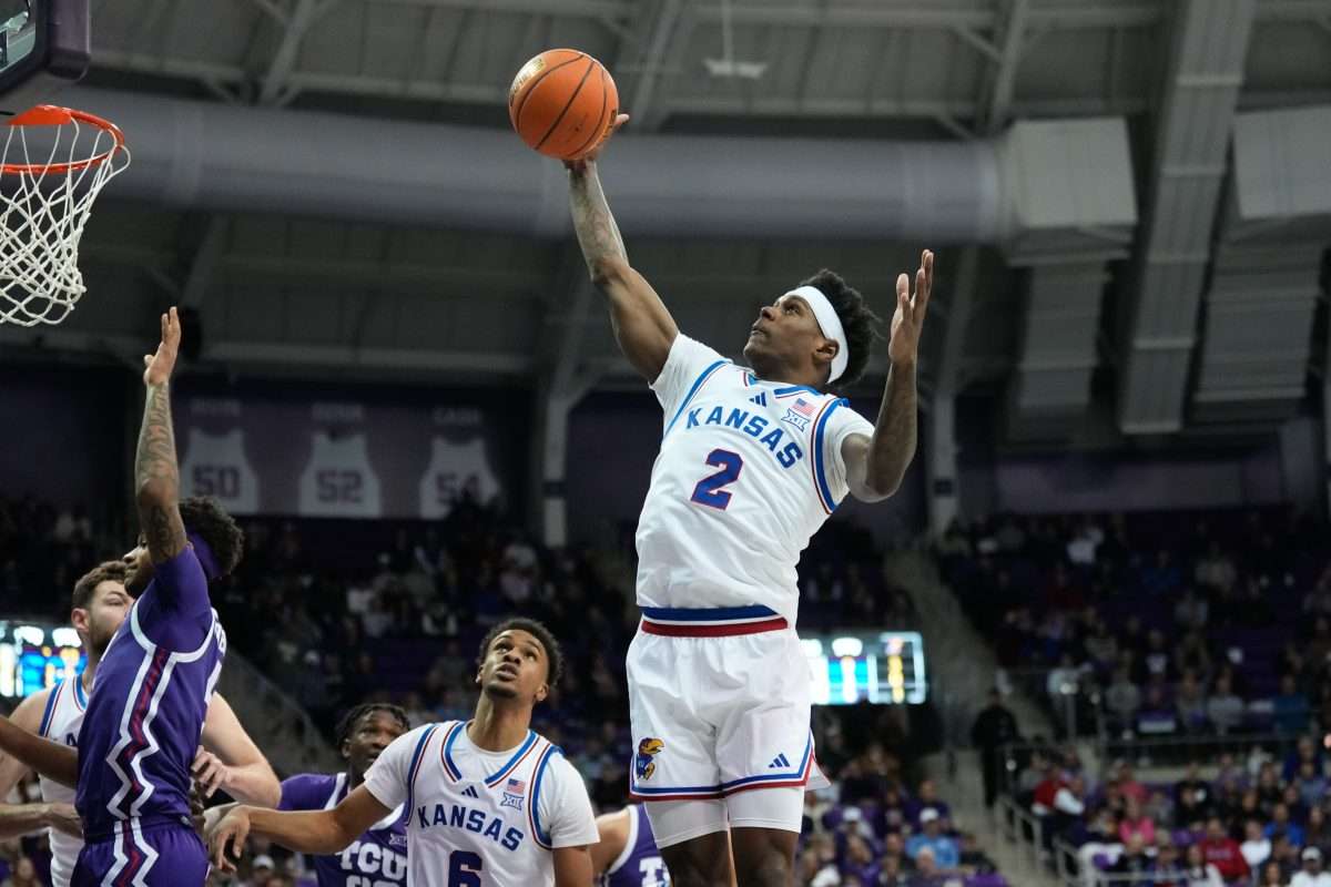 Jan 22, 2025; Fort Worth, Texas, USA; Kansas Jayhawks guard AJ Storr (2) grabs a rebound against the TCU Horned Frogs during the first half at Ed and Rae Schollmaier Arena. Mandatory Credit: Chris Jones-Imagn Images