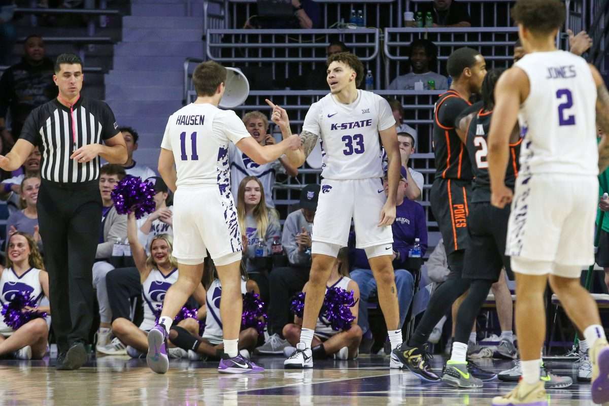 Jan 29, 2025; Manhattan, Kansas, USA; Kansas State Wildcats forward Coleman Hawkins (33) and guard Brendan Hausen (11) celebrate a play during the first half against the Oklahoma State Cowboys at Bramlage Coliseum. Mandatory Credit: Scott Sewell-Imagn Images