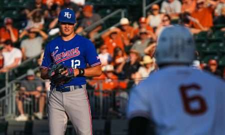 Kansas pitcher Dominic Voegele (12) watches Texas Longhorns catcher Rylan Galvan (6) before throwing a pitch during the game at UFCU Disch–Falk Field on Friday, May. 17, 2024 in Austin.