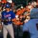 Kansas pitcher Dominic Voegele (12) watches Texas Longhorns catcher Rylan Galvan (6) before throwing a pitch during the game at UFCU Disch–Falk Field on Friday, May. 17, 2024 in Austin.
