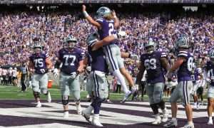 Sep 28, 2024; Manhattan, Kansas, USA; Kansas State Wildcats quarterback Avery Johnson (2) leaps into the arms of offensive lineman Hadley Panzer (54) after scoring a touchdown against the Oklahoma State Cowboys in the fourth quarter at Bill Snyder Family Football Stadium. Mandatory Credit: Scott Sewell-Imagn Images