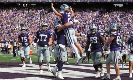 Sep 28, 2024; Manhattan, Kansas, USA; Kansas State Wildcats quarterback Avery Johnson (2) leaps into the arms of offensive lineman Hadley Panzer (54) after scoring a touchdown against the Oklahoma State Cowboys in the fourth quarter at Bill Snyder Family Football Stadium. Mandatory Credit: Scott Sewell-Imagn Images