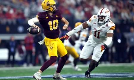 Dec 7, 2024; Arlington, TX, USA; Arizona State Sun Devils quarterback Sam Leavitt (10) throws a pass against Iowa State Cyclones defensive end Tyler Onyedim (11) in the second quarter at AT&T Stadium. Mandatory Credit: Tim Heitman-Imagn Images