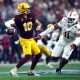 Dec 7, 2024; Arlington, TX, USA; Arizona State Sun Devils quarterback Sam Leavitt (10) throws a pass against Iowa State Cyclones defensive end Tyler Onyedim (11) in the second quarter at AT&T Stadium. Mandatory Credit: Tim Heitman-Imagn Images
