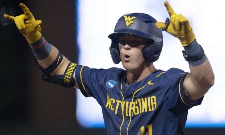 Jun 8, 2024; Chapel Hill, NC, USA; West Virginia Mountaineers Sam White (11) reacts to getting on base against the North Carolina Tar Heels in the ninth inning of the DI Baseball Super Regional at Boshamer Stadium. Mandatory Credit: Jeffrey Camarati-USA TODAY Sports