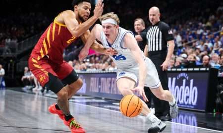 Mar 13, 2025; Kansas City, MO, USA; Brigham Young Cougars forward Richie Saunders (15) drives to the basket around Iowa State Cyclones forward Joshua Jefferson (2) during the first half at T-Mobile Center. Mandatory Credit: William Purnell-Imagn Images