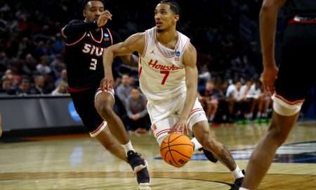 Mar 20, 2025; Wichita, KS, USA; Houston Cougars guard Milos Uzan (7) drives against SIU Edwardsville Cougars guard Ray'Sean Taylor (3) in the second half of a first round men’s NCAA Tournament game at Intrust Bank Arena. Mandatory Credit: Nick Tre. Smith-Imagn Images