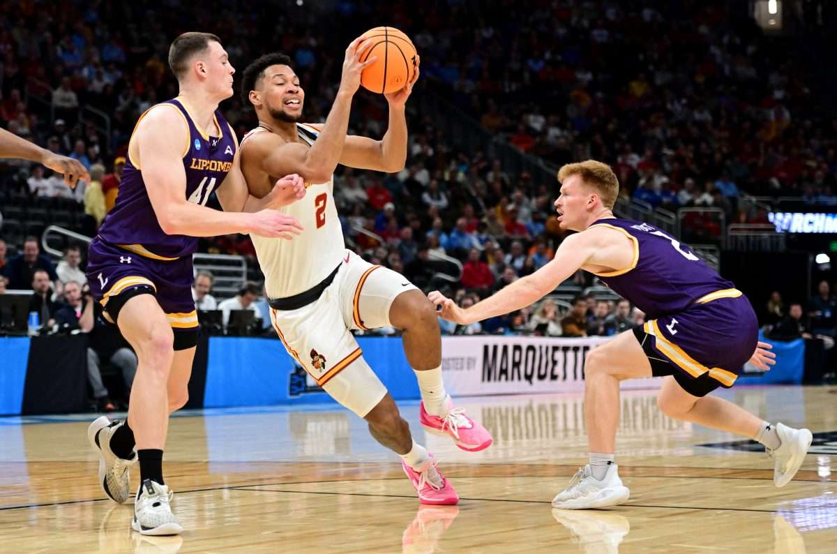 Mar 21, 2025; Milwaukee, WI, USA; Iowa State Cyclones forward Joshua Jefferson (2) drives against Lipscomb Bisons forward Jacob Ognacevic (41) and guard Will Pruitt (2) during the first half of a first round NCAA men’s tournament game at Fiserv Forum. Mandatory Credit: Benny Sieu-Imagn Images