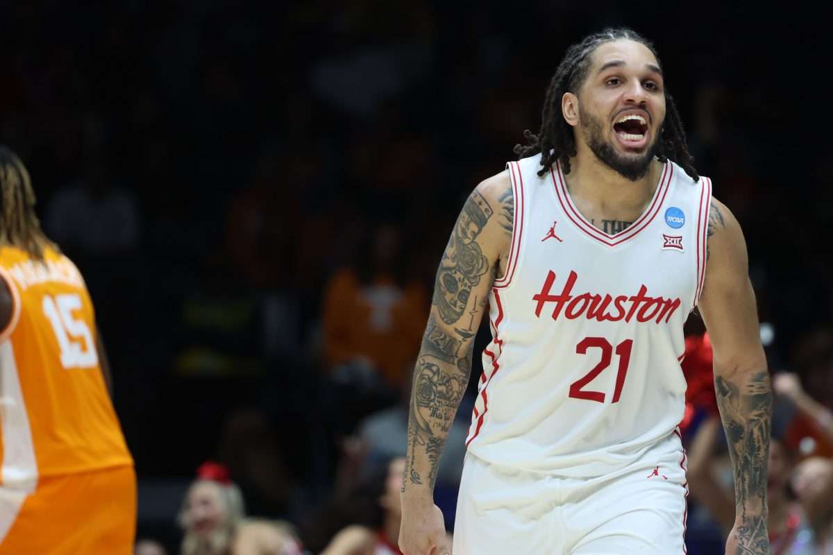 Mar 30, 2025; Indianapolis, IN, USA; Houston Cougars guard Emanuel Sharp (21) reacts against the Tennessee Volunteers in the second half during the Midwest Regional final of the 2025 NCAA tournament at Lucas Oil Stadium. Mandatory Credit: Trevor Ruszkowski-Imagn Images
