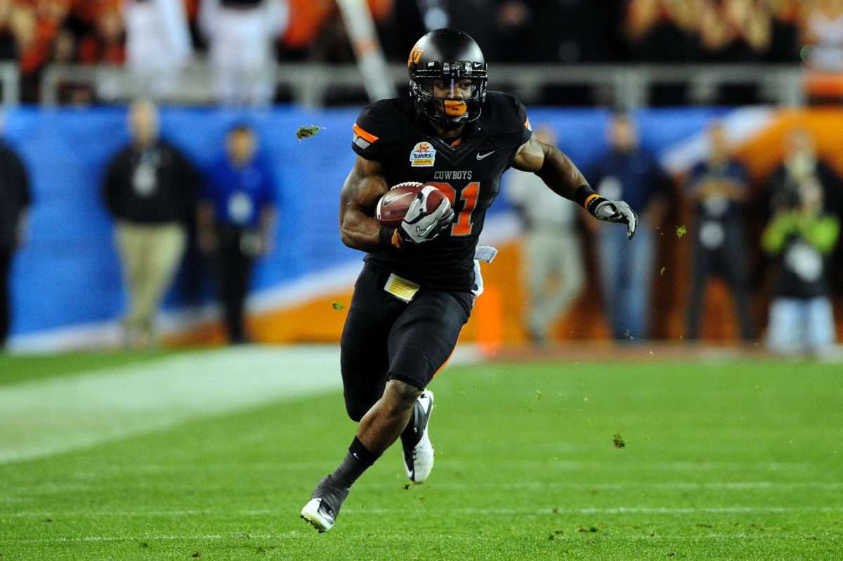 Jan 2, 2012; Glendale, AZ, USA; Oklahoma State Cowboys wide receiver Justin Blackmon (81) runs upfield during the second half against the Stanford Cardinal in the 2012 Fiesta Bowl at University of Phoenix Stadium. The Oklahoma State Cowboys beat the Stanford Cardinal 41-38 in overtime. Mandatory Credit: Matt Kartozian-USA TODAY Sports