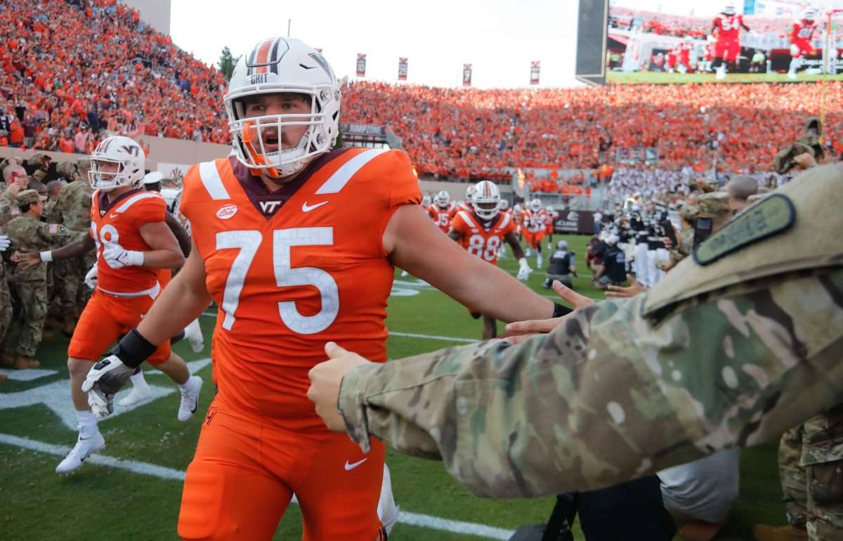 Sep 3, 2021; Blacksburg, Virginia, USA; Virginia Tech Hokies offensive lineman Bob Schick (75) greets fans before the game against the North Carolina Tar Heels at Lane Stadium. Mandatory Credit: Reinhold Matay-USA TODAY Sports
