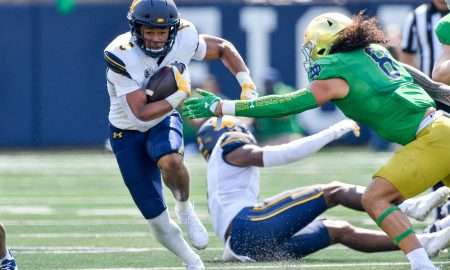 Sep 17, 2022; South Bend, Indiana, USA; California Bears running back Jadyn Ott (6) carries the ball as Notre Dame Fighting Irish linebacker Marist Liufau (8) attempts to tackle in the first quarter at Notre Dame Stadium. Mandatory Credit: Matt Cashore-USA TODAY Sports