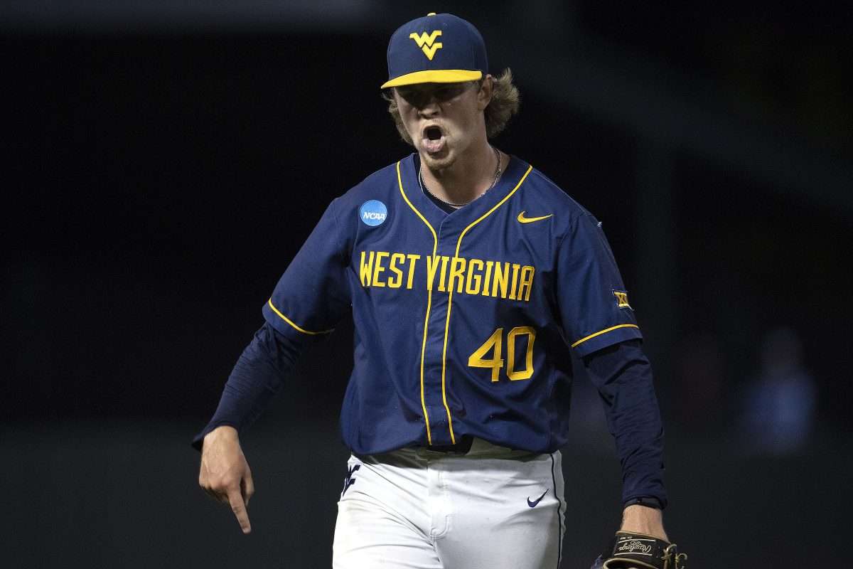 Jun 8, 2024; Chapel Hill, NC, USA; West Virginia Mountaineers pitcher Carson Estridge (40) reacts to getting an out against the North Carolina Tar Heels in the eighth inning of the DI Baseball Super Regional at Boshamer Stadium. Mandatory Credit: Jeffrey Camarati-USA TODAY Sports