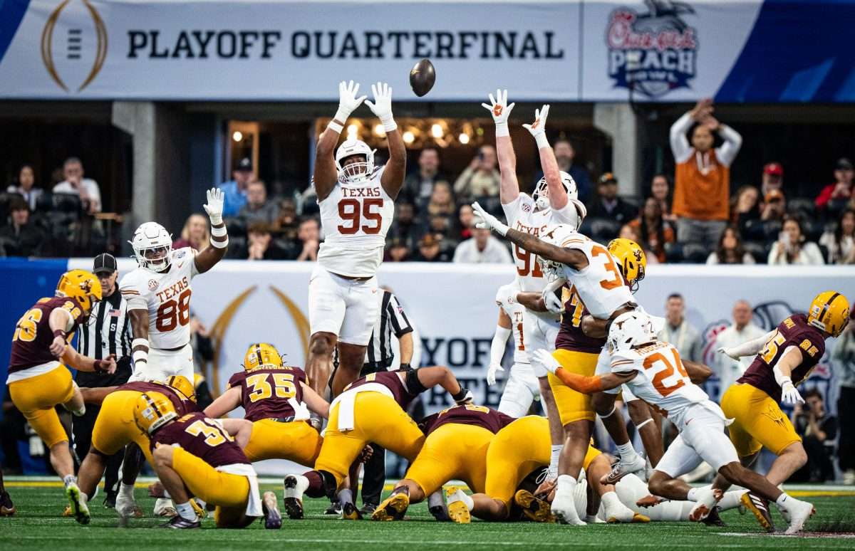 The Texas defense reach, attempting to block a field goal attempt from Arizona State Sun Devils kicker Carston Kieffer (26) in the first quarter as the Texas Longhorns play the Arizona State Sun Devils in the Peach Bowl College Football Playoff quarterfinal at Mercedes-Benz Stadium in Atlanta, Georgia, Jan. 1, 2025.