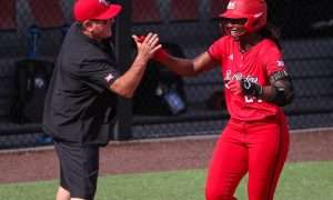 Texas Tech's NiJaree Canady high-fives head coach Gerry Glasco after hitting a home run against Brown during a game in the Lubbock Regional as part of the 2025 NCAA softball tournament, Friday, May 16, 2025, at Rocky Johnson Field.