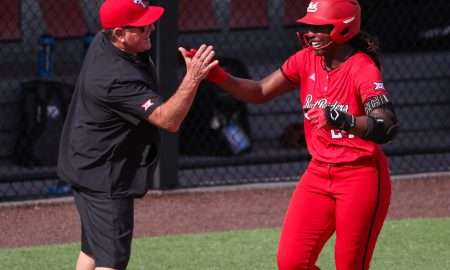 Texas Tech's NiJaree Canady high-fives head coach Gerry Glasco after hitting a home run against Brown during a game in the Lubbock Regional as part of the 2025 NCAA softball tournament, Friday, May 16, 2025, at Rocky Johnson Field.