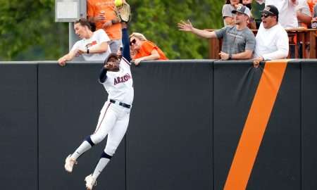 Arizona's Dakota Kennedy (4) can not catch the home run ball of Oklahoma State's Tallen Edwards in the first inning of Game 2 of the NCAA softball tournament Stillwater Super Regional between the Oklahoma State Cowgirls and the Arizona Wildcats in Stillwater, Okla., Saturday, May, 25, 2024.