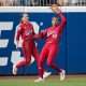 Jun 2, 2025; Oklahoma City, OK, USA; Texas Tech Red Raiders outfielder Mihyia Davis (42) makes a catch for an out as outfielder Demi Elder (2) backs her up in the third inning against the Oklahoma Sooners during the NCAA Softball Women's College World Series semifinal game at Devon Park. Mandatory Credit: Brett Rojo-Imagn Images