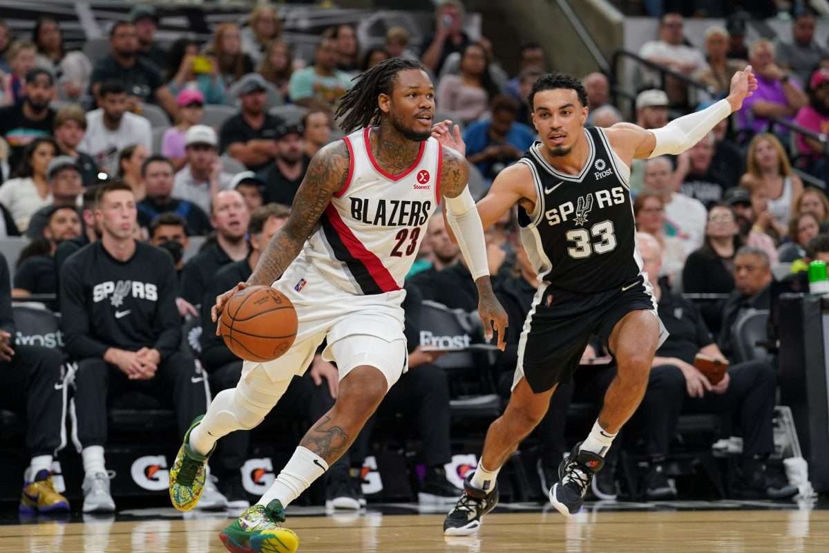 Apr 3, 2022; San Antonio, Texas, USA; Portland Trail Blazers guard Ben McLemore (23) dribbles past San Antonio Spurs guard Tre Jones (33) in the second half at the AT&T Center. Mandatory Credit: Daniel Dunn-USA TODAY Sports