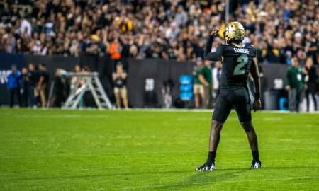CU football's junior quarterback Shedeur Sanders flexes for the crowd before the Rocky Mountain Showdown on Sept. 16, 2023 at Folsom Field in Boulder, Colo.