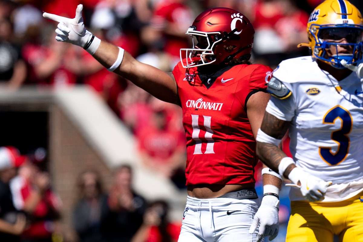 Cincinnati Bearcats tight end Joe Royer (11) reacts to getting a first down in the first quarter of the College Football game between the Cincinnati Bearcats and the Pittsburgh Panthers at Nippert Stadium in Cincinnati on Saturday, Sept. 7, 2024.