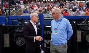Big 12 commissioner is Brett Yormark, left, and SEC commissioner Greg Sankey talk before Game 1 of the Women's College World Series championship series between the Texas Longhorns at Texas Tech Red Raiders at Devon Park in Oklahoma City, Wednesday, June 4, 2025. Texas won 2-1.
