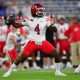 Aug 30, 2025; Pasadena, California, USA; Utah Utes quarterback Devon Dampier (4) throws against the against the UCLA Bruins during the first half at the Rose Bowl. Mandatory Credit: Gary A. Vasquez-Imagn Images