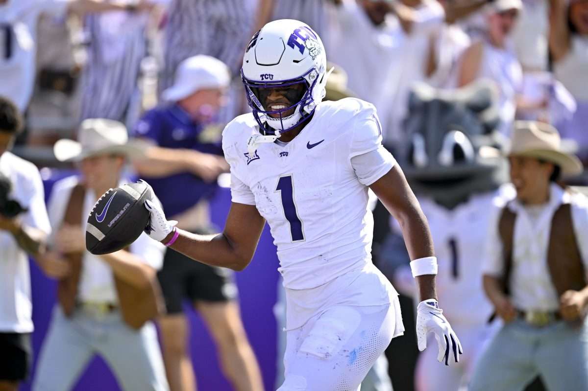 Sep 20, 2025; Fort Worth, Texas, USA; TCU Horned Frogs wide receiver Eric McAlister (1) smiles as he scores a touchdown against the SMU Mustangs during the first half at Amon G. Carter Stadium. Mandatory Credit: Jerome Miron-Imagn Images