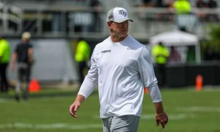 Sep 20, 2025; Orlando, Florida, USA; UCF Knights head coach Scott Frost looks on during warmups before the game against the North Carolina Tar Heels at the Bounce House Stadium. Mandatory Credit: Mike Watters-Imagn Images