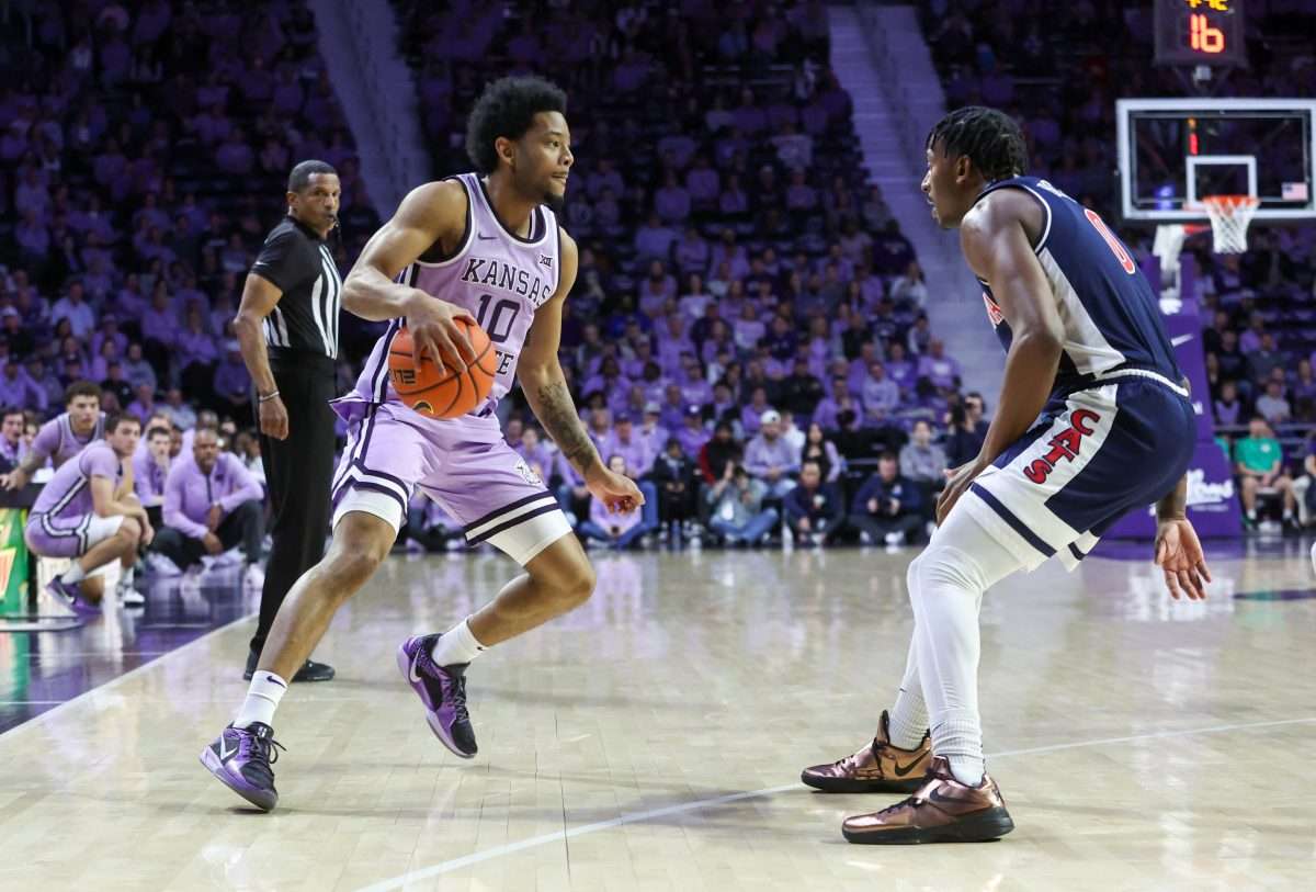 Feb 11, 2025; Manhattan, Kansas, USA; Kansas State Wildcats guard David Castillo (10) dribbles against Arizona Wildcats guard Jaden Bradley (0) during the first half at Bramlage Coliseum. Mandatory Credit: Scott Sewell-Imagn Images
