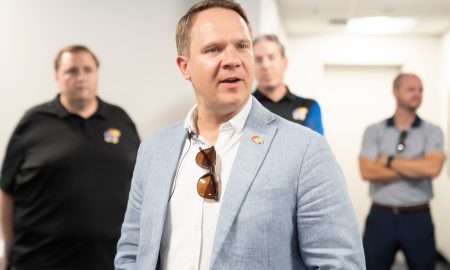 Kansas athletic director Travis Goff gives remarks during a media walkthrough tour of David Booth Kansas Memorial Stadium on Aug. 19, 2025.