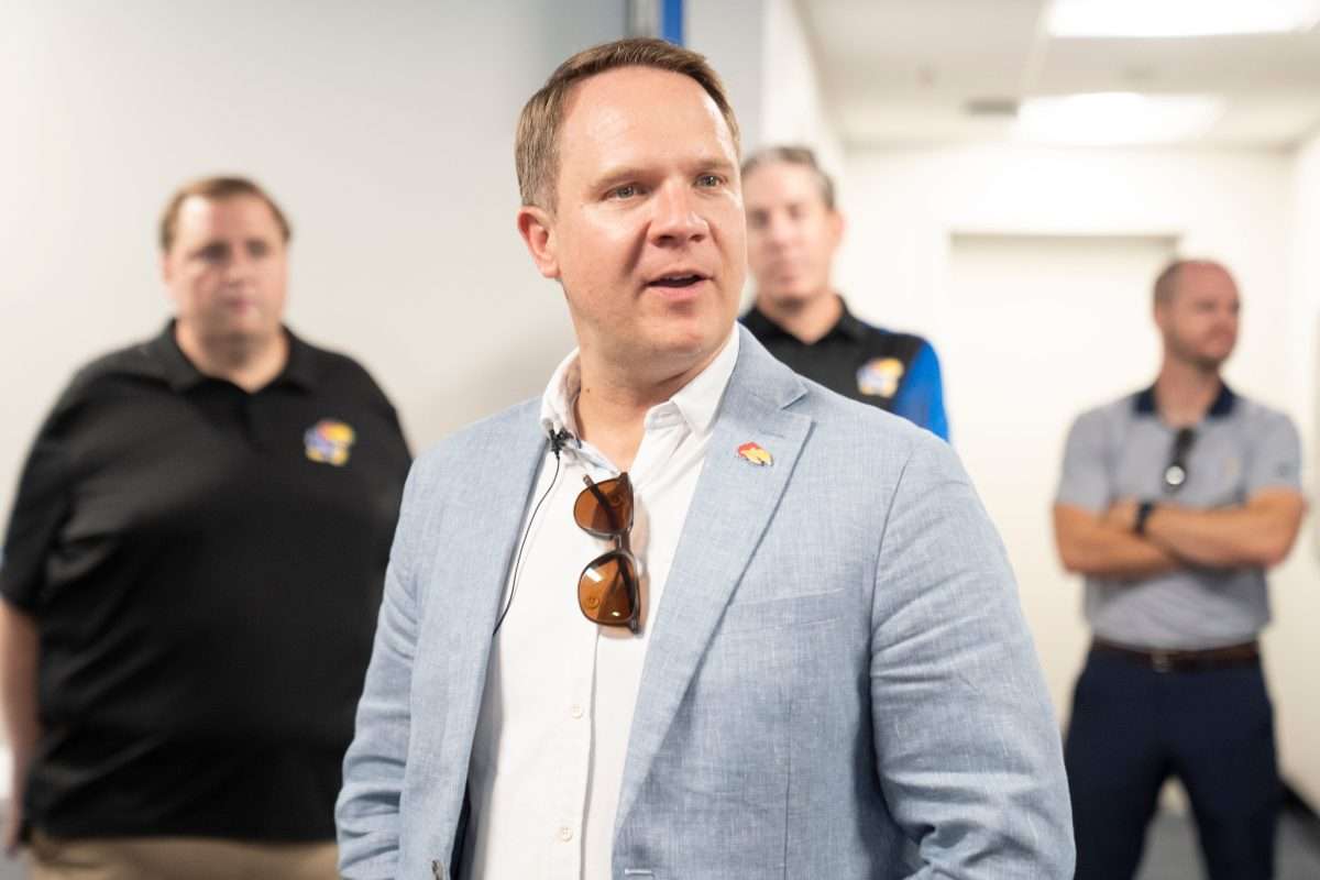 Kansas athletic director Travis Goff gives remarks during a media walkthrough tour of David Booth Kansas Memorial Stadium on Aug. 19, 2025.