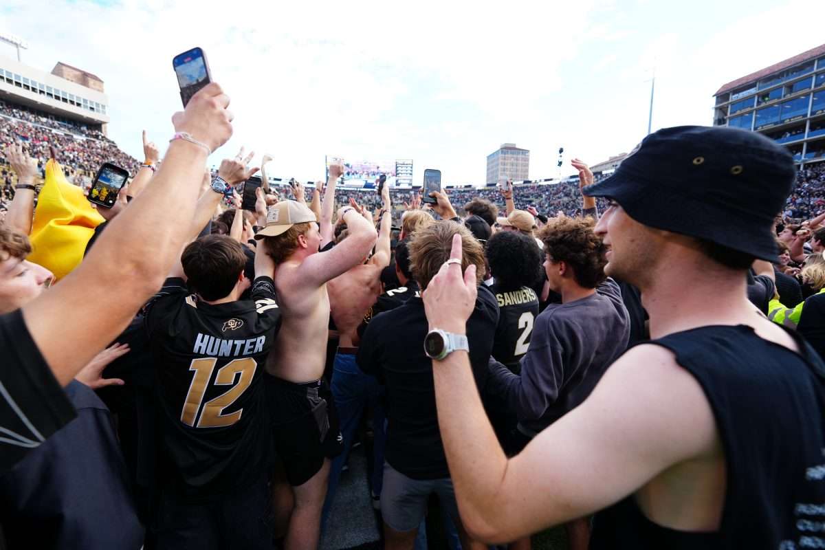 Oct 11, 2025; Boulder, Colorado, USA; Colorado Buffaloes fans celebrate defeating the Iowa State Cyclones at Folsom Field. Mandatory Credit: Ron Chenoy-Imagn Images