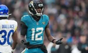 Oct 19, 2025; London, United Kingdom; Jacksonville Jaguars wide receiver Travis Hunter (12) reacts after a play against the Los Angeles Rams during the second half of an NFL International Series game at Wembley Stadium. Mandatory Credit: Kirby Lee-Imagn Images