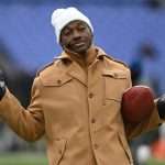 Jan 20, 2024; Baltimore, MD, USA; ESPN college football and NFL analyst Robert Griffin III reacts on the sidelines before a 2024 AFC divisional round game between the Houston Texans and the Baltimore Ravens at M&T Bank Stadium. Mandatory Credit: Tommy Gilligan-USA TODAY Sports