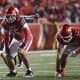 Oct 11, 2025; Salt Lake City, Utah, USA; Utah Utes offensive lineman Spencer Fano (55) and Utah Utes offensive lineman Michael Mokofisi (52) wait for the play during the third quarter of the game against the Arizona State Sun Devils at Rice-Eccles Stadium. Mandatory Credit: Rob Gray-Imagn Images