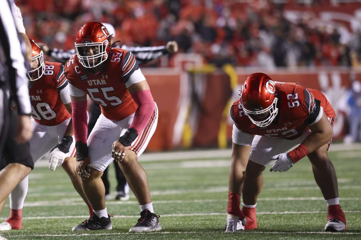 Oct 11, 2025; Salt Lake City, Utah, USA; Utah Utes offensive lineman Spencer Fano (55) and Utah Utes offensive lineman Michael Mokofisi (52) wait for the play during the third quarter of the game against the Arizona State Sun Devils at Rice-Eccles Stadium. Mandatory Credit: Rob Gray-Imagn Images