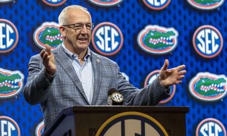 Oct 15, 2025; Birmingham, AL, USA; SEC commissioner Greg Sankey introduces Florida Gators head coach Todd Golden during SEC Media Days at Grand Bohemian Hotel. Mandatory Credit: Vasha Hunt-Imagn Images