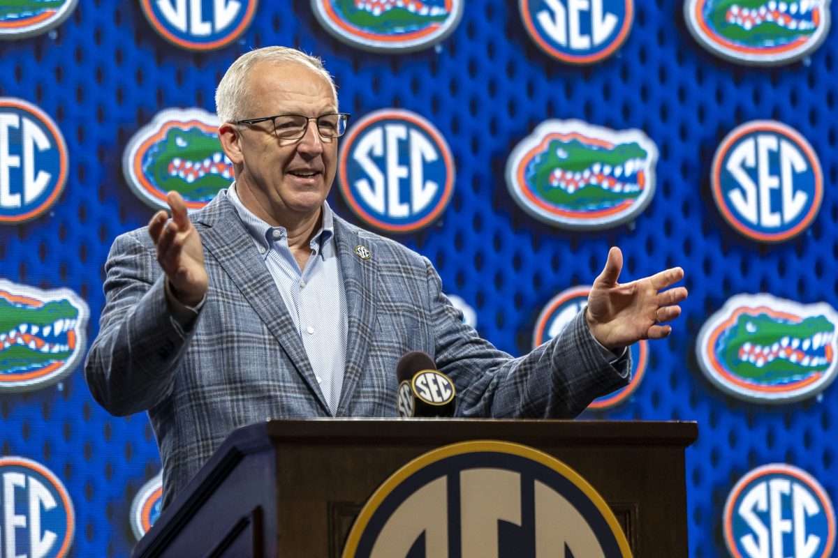Oct 15, 2025; Birmingham, AL, USA; SEC commissioner Greg Sankey introduces Florida Gators head coach Todd Golden during SEC Media Days at Grand Bohemian Hotel. Mandatory Credit: Vasha Hunt-Imagn Images