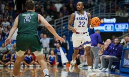 Nov 3, 2025; Lawrence, Kansas, USA; Kansas Jayhawks guard Darryn Peterson (22) dribbles the ball during the second half against the Green Bay Phoenix at Allen Fieldhouse. Mandatory Credit: Jay Biggerstaff-Imagn Images